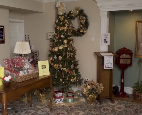Lobby with holiday tree and visitor welcome stand
